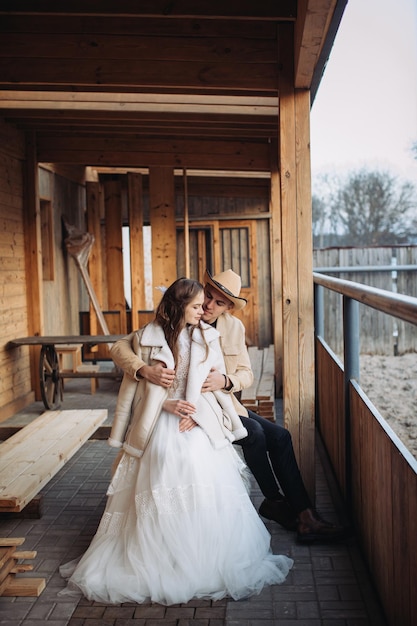 Loving couple on a ranch in the west in winter