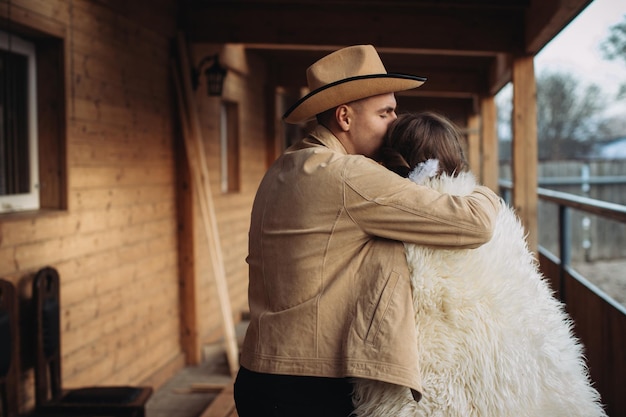 Loving couple on a ranch in the west in winter