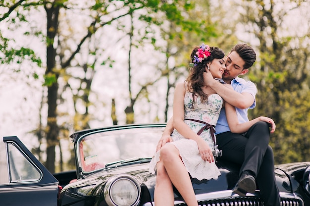 loving couple in a retro car