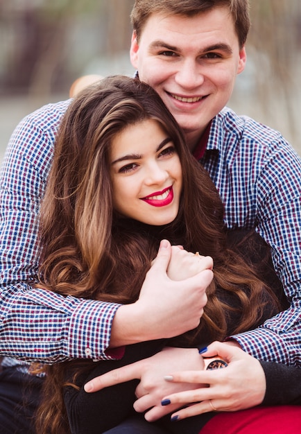 Loving couple sitting on a bench