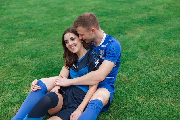 loving couple  on the soccer field. 