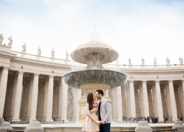 Loving couple at the St. Peter's Square in Vatican