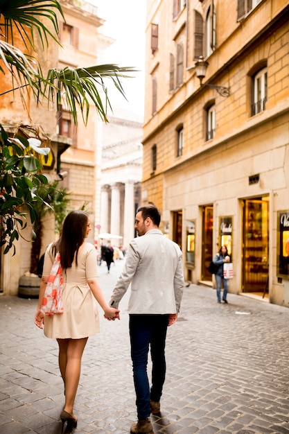 Loving couple walking on the street of Rome, Italy