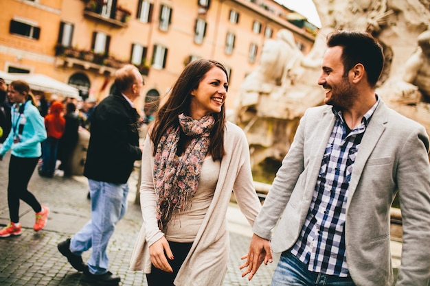 Loving couple walking on the street of Rome, Italy