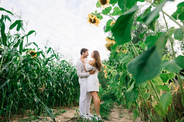 Loving couple in white dresses kissing