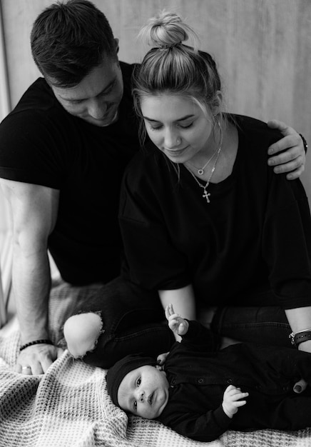 Loving family with newborn baby Happy parents with their newborn boy