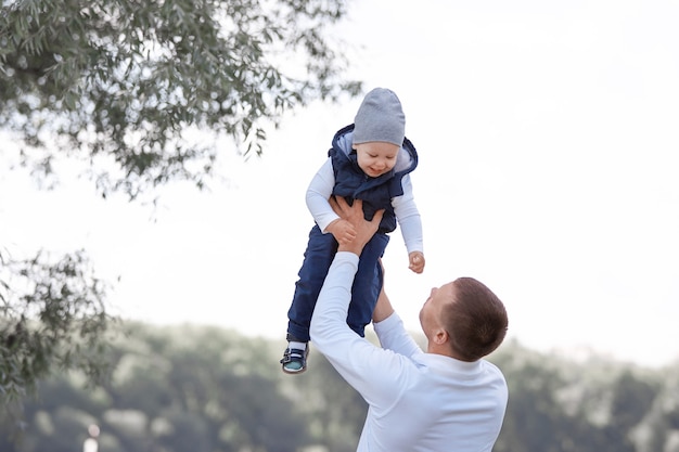 Loving father playing with his son outdoors. the concept of parenting