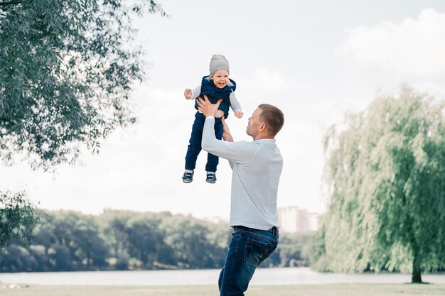 Loving father playing with his son outdoors