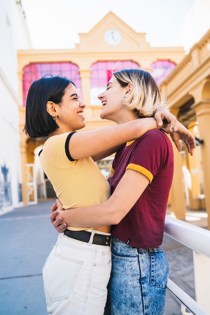 Loving lesbian couple at the street.