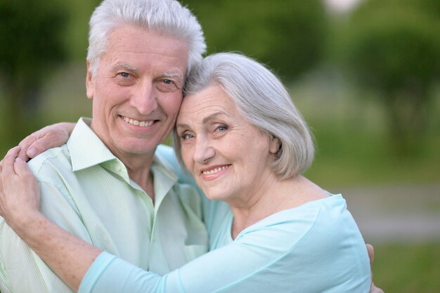 Loving mature couple in a summer park