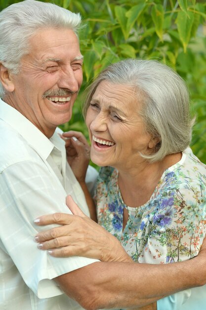 Loving mature couple  in a summer park