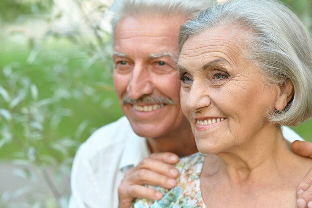 Loving mature couple  in a summer park