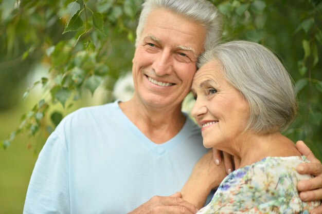 Loving mature couple  in a summer park