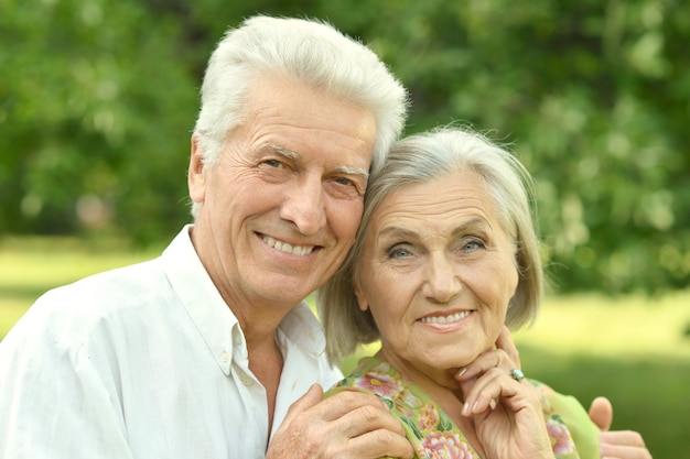 Loving mature couple  in a summer park