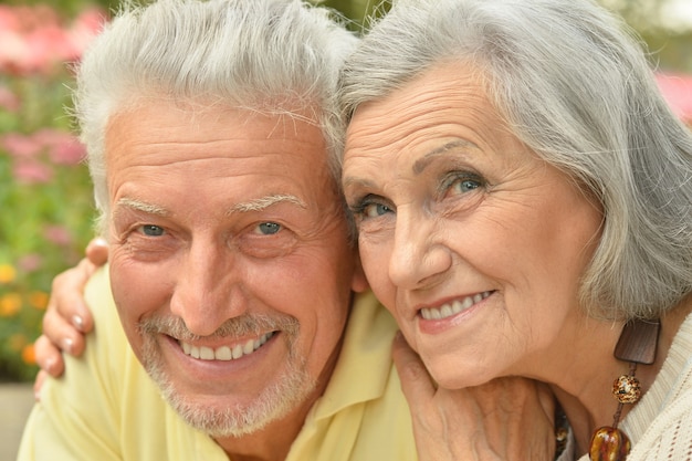 Loving mature couple  in a summer park