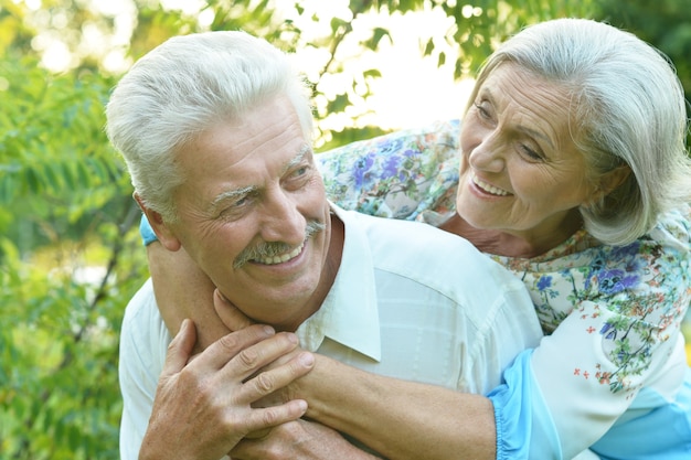 Loving mature couple in a summer park