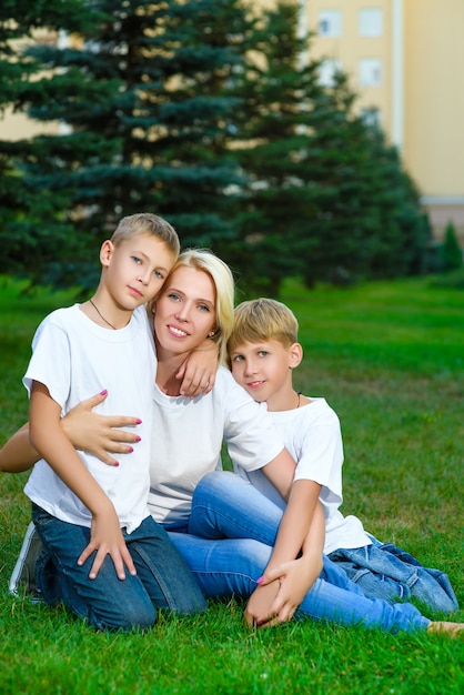 Loving mother hugging her young son on the cheek