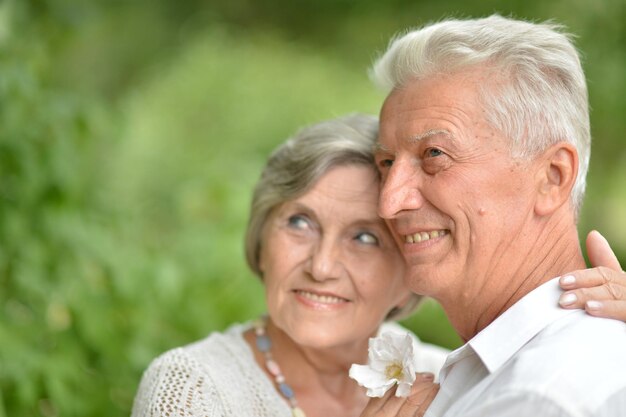 Loving older couple on a walk in the park together