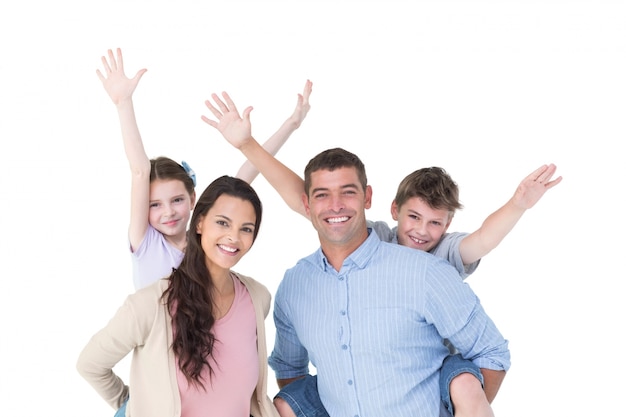 Photo loving parents giving piggyback ride to children