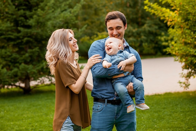 Loving parents hug the baby