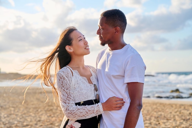 Loving romantic hugging young couple on the seashore