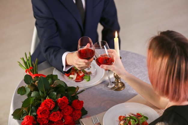 Loving young couple during romantic date in restaurant