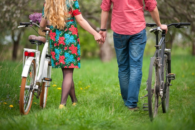 Loving young couple with bicycles