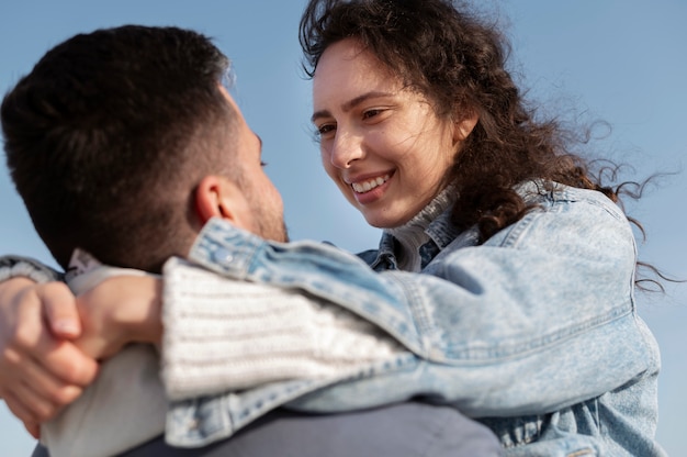 Low angle happy couple outdoors