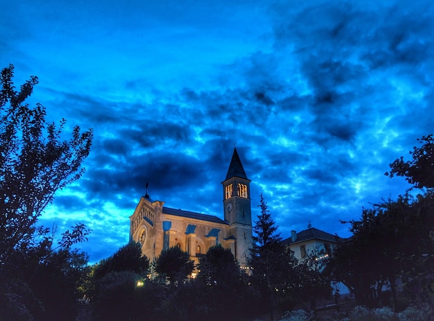 Low angle shot of church at night