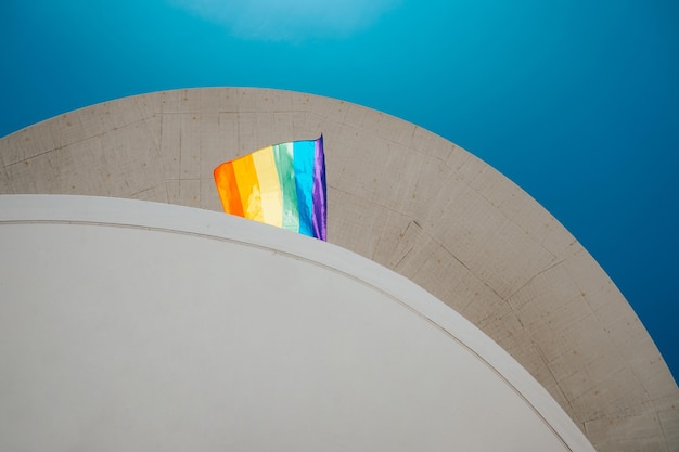 Low angle shot of a colorful flag waving in a balcony