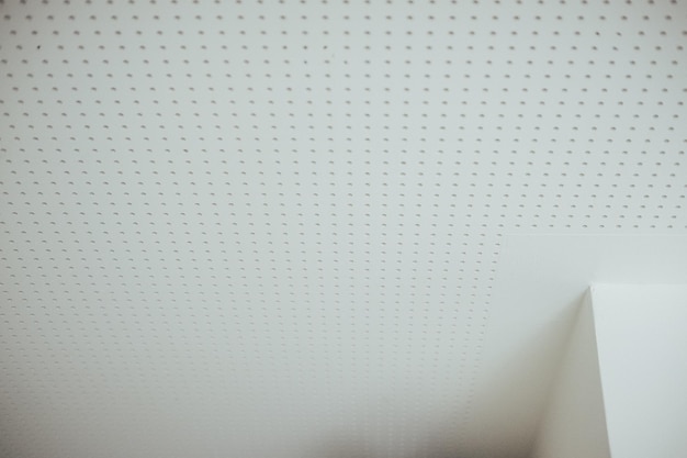 Low angle shot of a spotted white ceiling