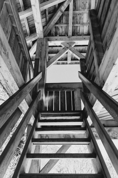 Low angle shot of stairs as they lead to the remainder of the wooden house
