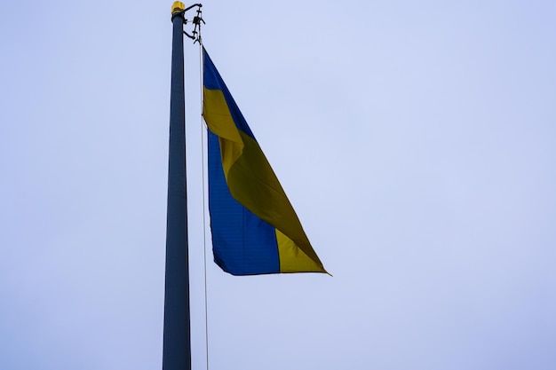 Low angle shot of ukrainian flag agaisnt blue sky