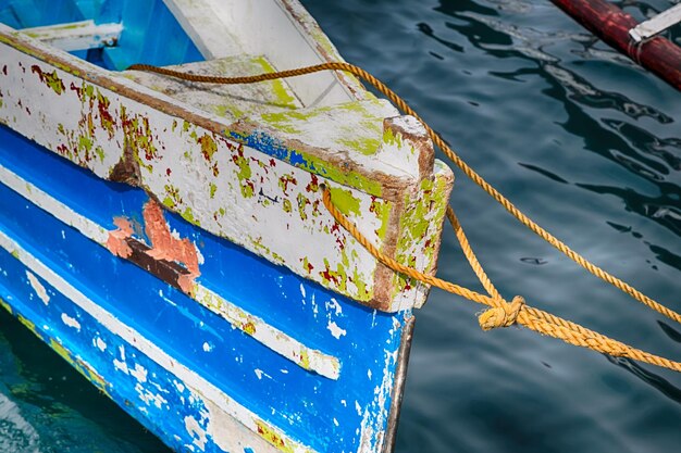 Low angle view of abandoned boat moored in sea