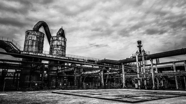 Low angle view of abandoned building against sky