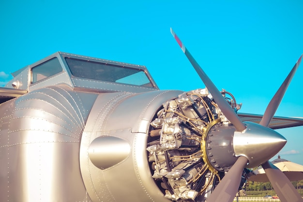 Low angle view of airplane against clear blue sky