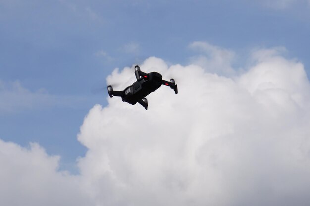 Low angle view of airplane flying against sky