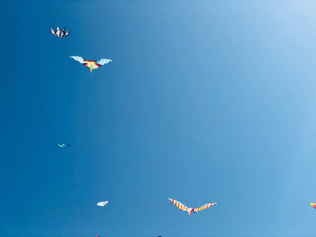 Low angle view of airplane flying in sky