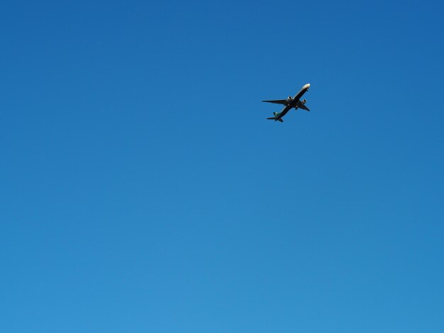 Low angle view of airplane flying in sky