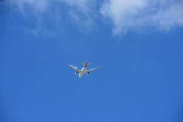 Low angle view of airplane flying in sky