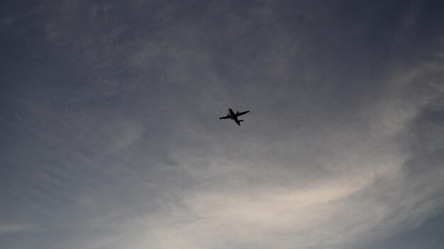 Low angle view of airplane flying in sky