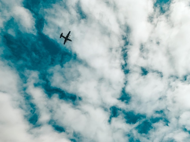 Low angle view of airplane flying in sky