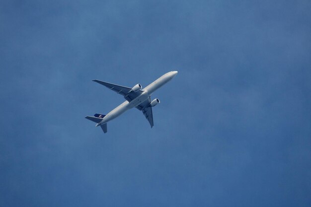 Low angle view of airplane flying in sky