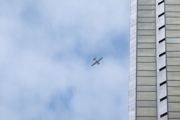 Low angle view of airplane flying in sky