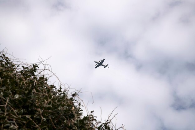 Low angle view of airplane flying in sky