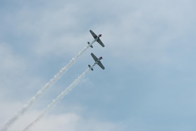 Low angle view of airshow against sky