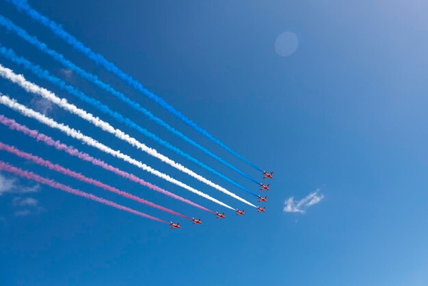 Low angle view of airshow against sky