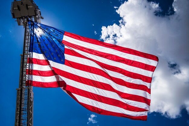 Low angle view of american flag against cloudy sky