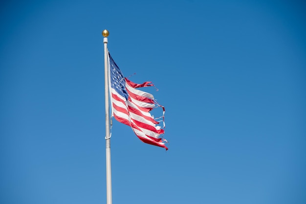 Low angle view of American flag on pole