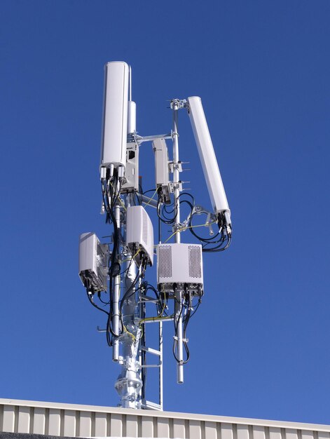 Low angle view of antenna against clear blue sky